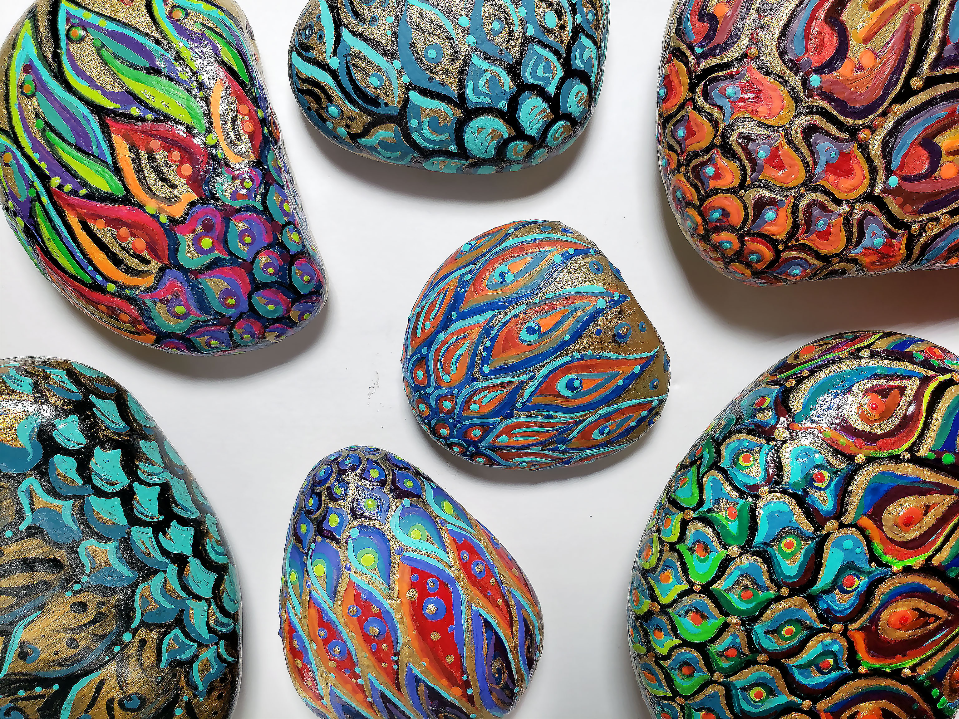 Pacific Northwest Beach Rocks Hand Painted like Colorful Mermaid Tails and Peacock Feathers.